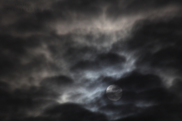 A cool moon through the clouds shot